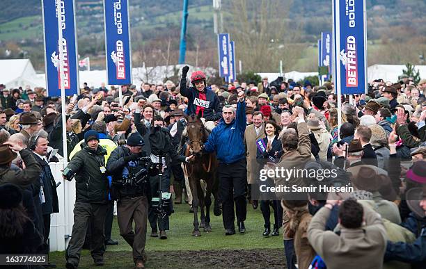 Bobs Worth and Barry Geraghty celebrate winning the Gold Cup on day 4 of the Cheltenham Festival on Gold Cup Day at Cheltenham racecourse on March...