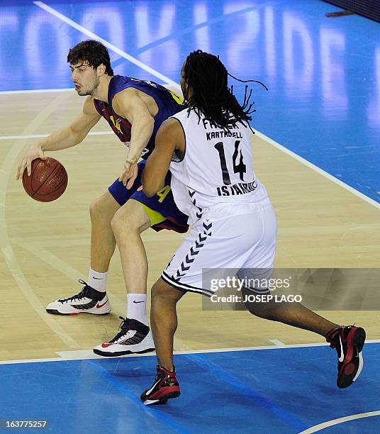 Regal Barcelona's Croatian centre Ante Tomic vies with Besiktas JK Istanbul's US forward Randal Falker during the Euroleague basketball match FC...