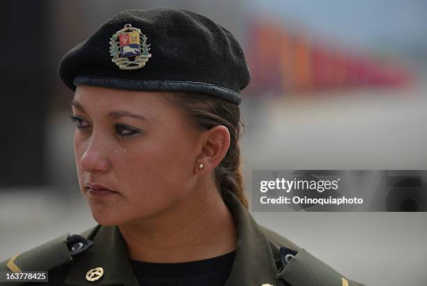 Soldier woman cries during the funeral of Venezuelan President Hugo Chavez who died past March 5 after a fight against cancer during the last two...