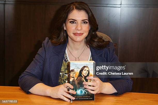 Author Stephenie Meyer signs copies of her book "The Host" at the celebration of the film release of "The Host" at Barnes & Noble bookstore at The...