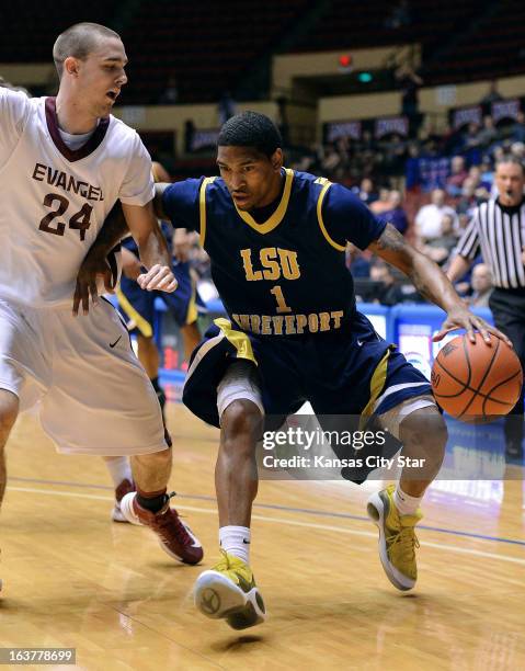 Evangel University's Brodie Wingert defends against Louisiana State University-Shreveport's Mark Politte in the NAIA tournament on Friday, March 15...