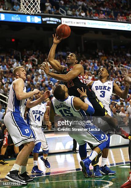 Pe'Shon Howard of the Maryland Terrapins shoots over Josh Hairston of the Duke Blue Devils in the second half of their game during the quarterfinals...