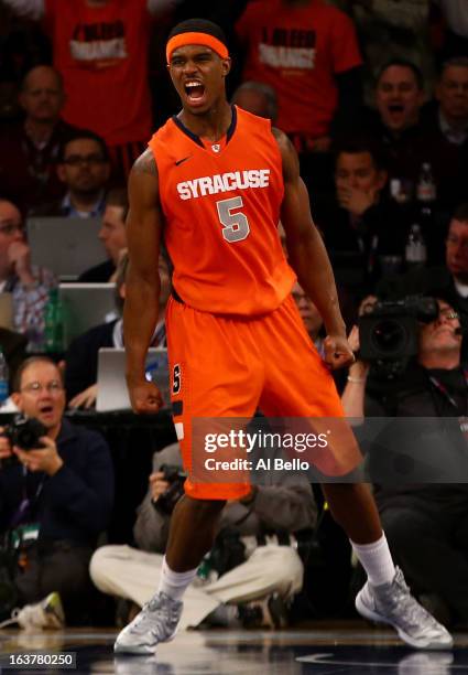 Fair of the Syracuse Orange reacts after he dunked the ball against the Georgetown Hoyas during the semifinals of the Big East Men's Basketball...