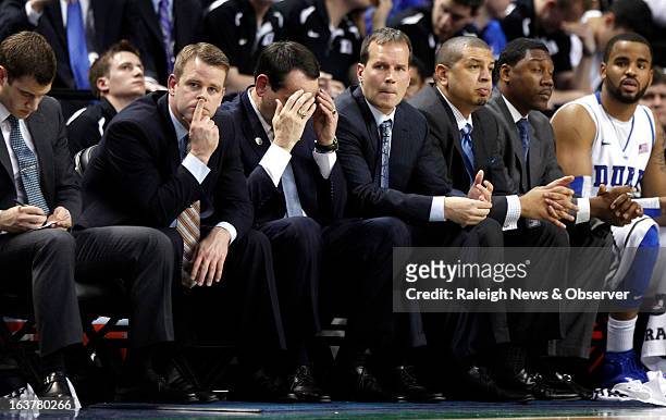 Duke's coaches, from left, Steve Wojciechowski, Mike Krzyzewski, Chris Collins, Jeff Capel and Nate James watch during the second half against...