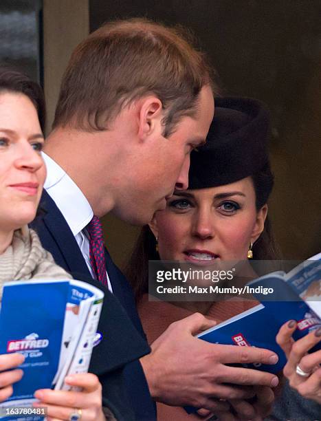 Prince William, Duke of Cambridge and Catherine, Duchess of Cambridge watch the racing as they attend Day 4 of The Cheltenham Festival at Cheltenham...