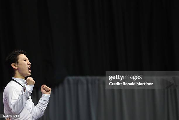 Denis Ten of Kazakhstan celebrates after winning the silver medal in the Mens Free Skating during the 2013 ISU World Figure Skating Championships at...