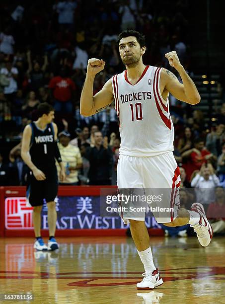 Carlos Delfino of the Houston Rockets celebrates a basket during the game against the Minnesota Timberwolves at Toyota Center on March 15, 2013 in...