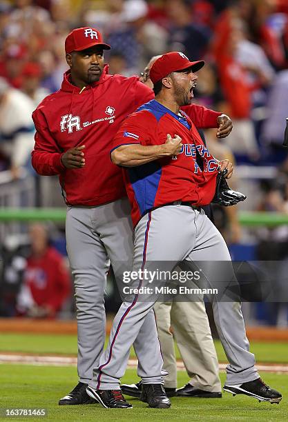 Romero of Puerto Rico reacts to winning a World Baseball Classic second round game against the United States at Marlins Park on March 15, 2013 in...