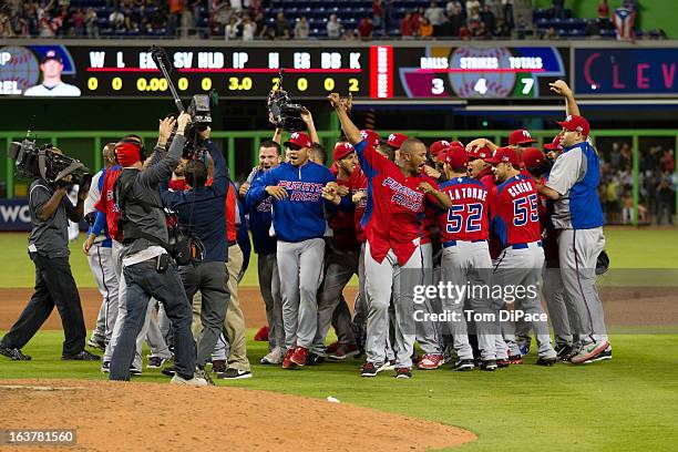 Team Puerto Rico celebrates after defeating Team USA in Pool 2, Game 4 in the second round of the 2013 World Baseball Classic on Friday, March 15,...