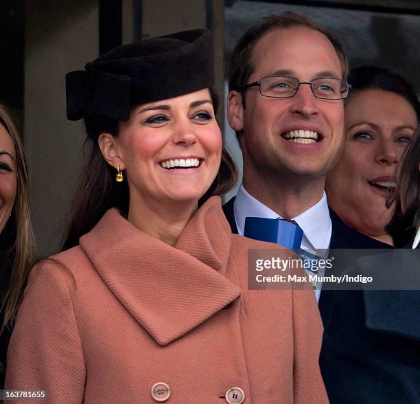 Catherine, Duchess of Cambridge and Prince William, Duke of Cambridge watch the racing as they attend Day 4 of The Cheltenham Festival at Cheltenham...