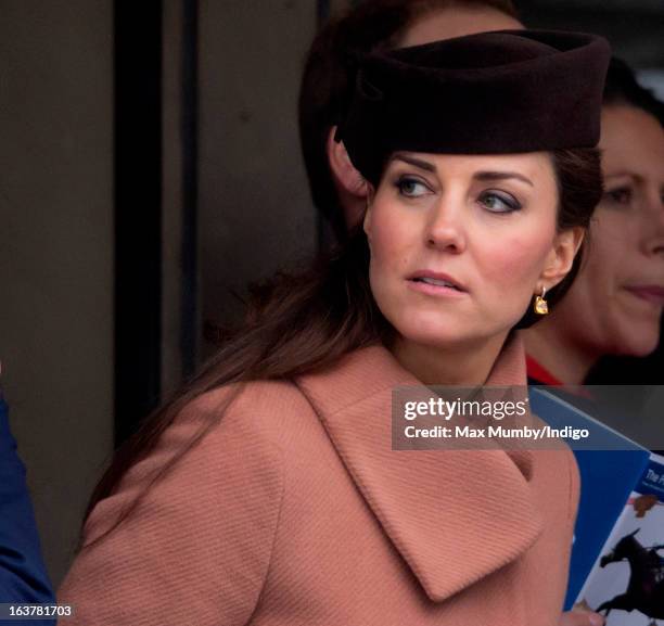 Catherine, Duchess of Cambridge watches the racing as she attends Day 4 of The Cheltenham Festival at Cheltenham Racecourse on March 15, 2013 in...