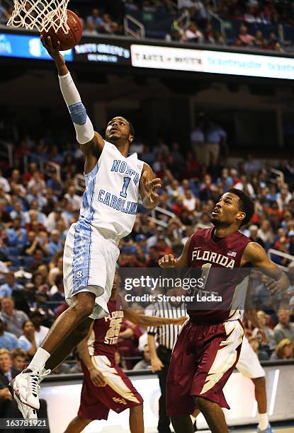 Dexter Strickland of the North Carolina Tar Heels shoots over Devon Bookert of the Florida State Seminoles in the second half during the...