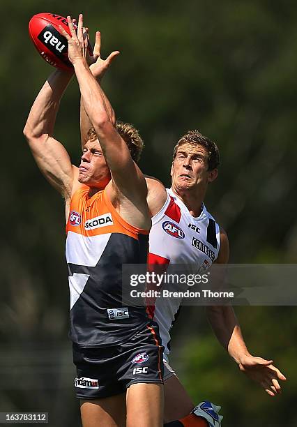 Adam Kennedy of the Giants competes with Nick Dal Santo of the Saints during the AFL practice match between the Greater Western Sydney Giants and the...