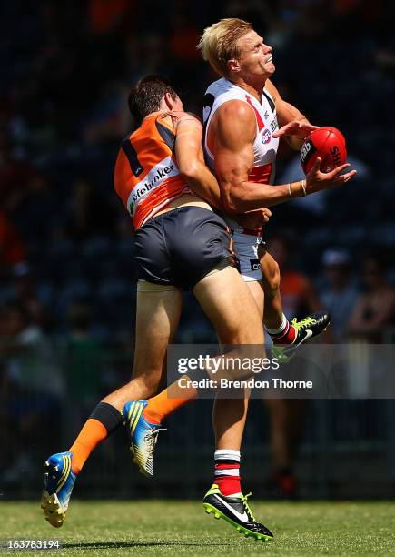 Nick Riewoldt of the Saints competes with Phil Davis of the Giants during the AFL practice match between the Greater Western Sydney Giants and the St...