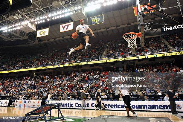 Member of the Air Elite Dunkers performs during halftime of a game between the Virginia Tech Hokies and the North Carolina State Wolfpack during the...