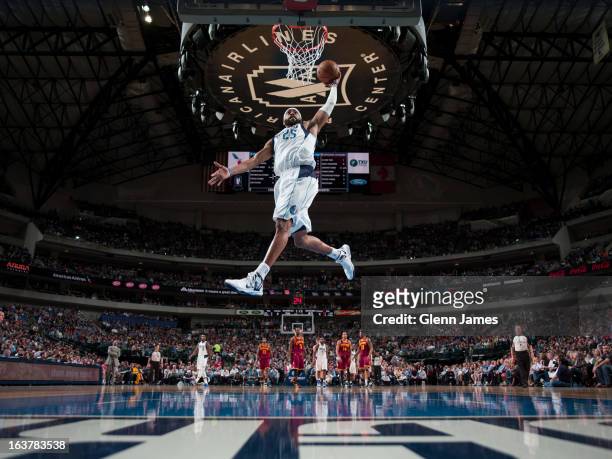 Vince Carter of the Dallas Mavericks dunks on a fast break against the Cleveland Cavaliers on March 15, 2013 at the American Airlines Center in...
