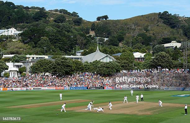 Ian Bell of England catches out Hamish Rutherford of New Zealand from the bowling for Monty Panesar during day three of the second Test match between...