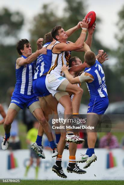 Ben Stratton of the Hawks marks the ball during the AFL NAB Cup match between the North Melbourne Kangaroos and the Hawthorn Hawks at Highgate...