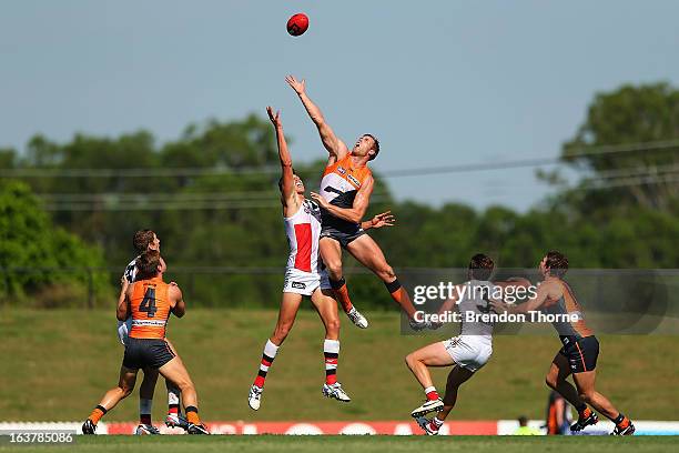 Jonathan Giles of the Giants competes with Tom Hickey of the Saints during the AFL practice match between the Greater Western Sydney Giants and the...