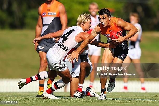 Dylan Shiel of the Giants competes with Clinton Jones of the Saints during the AFL practice match between the Greater Western Sydney Giants and the...