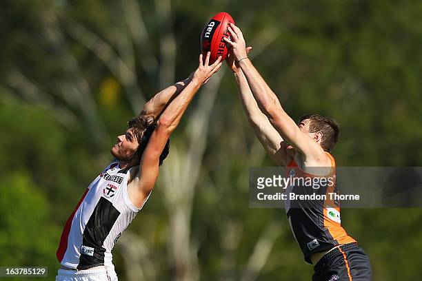 Dylan Roberton of the Saints competes with Jeremy Cameron of the Giants during the AFL practice match between the Greater Western Sydney Giants and...