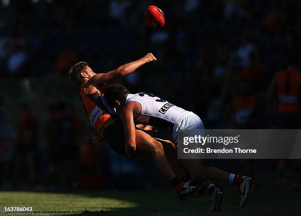 Callan Ward of the Giants competes with Jack Steven of the Saints during the AFL practice match between the Greater Western Sydney Giants and the St...