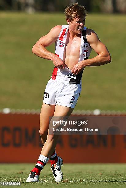 Jack Newnes of the Saints pulls off his torn jersey during the AFL practice match between the Greater Western Sydney Giants and the St Kilda Saints...