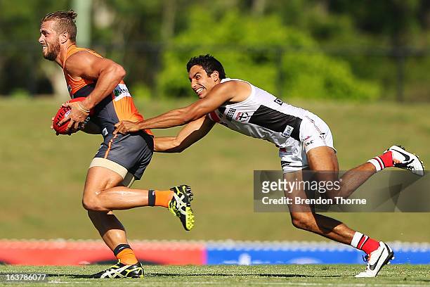 Tim Mohr of the Giants competes with Terry Milera of the Saints during the AFL practice match between the Greater Western Sydney Giants and the St...