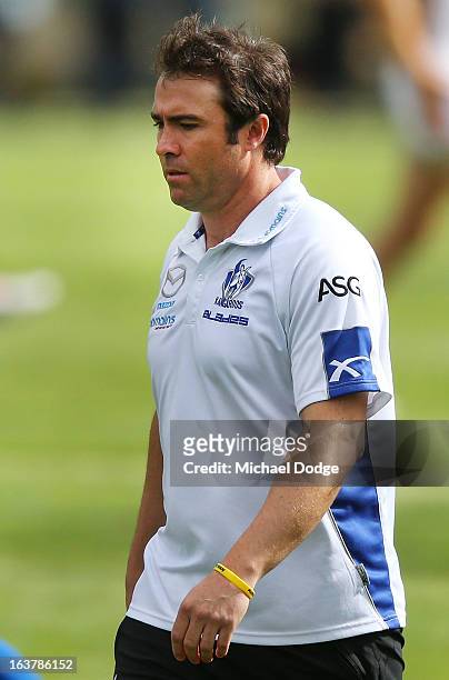 Kangaroos coach Brad Scott walks off after his three quarter time huddle address during the AFL NAB Cup match between the North Melbourne Kangaroos...