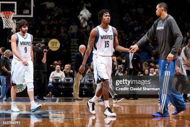 Mickael Gelabale of the Minnesota Timberwolves celebrates with teammate Chris Johnson during a game against the San Antonio Spurs on March 12, 2013...