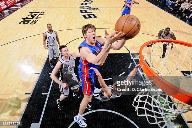 Viacheslav Kravtsov of the Detroit Pistons drives to the basket against the San Antonio Spurs on March 3, 2013 at the AT&T Center in San Antonio,...