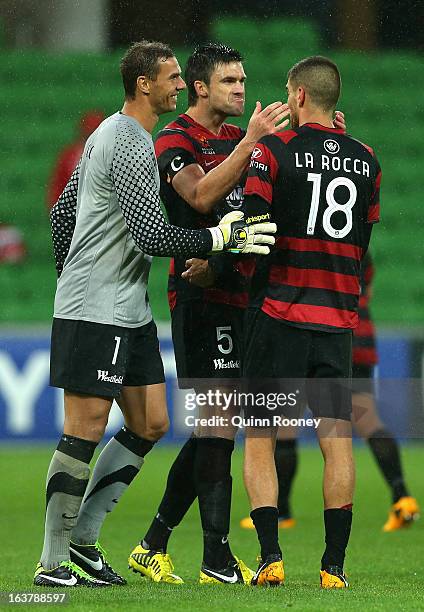 Ante Covic, Michael Beauchamp, Iacopo La Rocca of the Wanderers celebrate winning the round 25 A-League match between the Melbourne Heart and the...