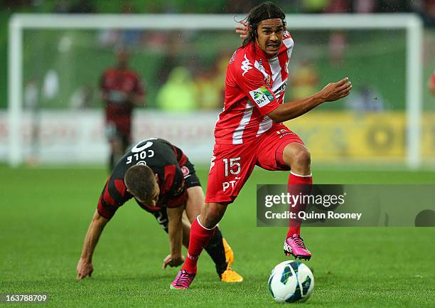 David Williams of the Heart gets past Shannon Cole of the Wanderers during the round 25 A-League match between the Melbourne Heart and the Western...