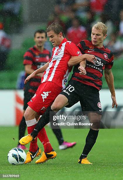Matt Thompson of the Heart and Aaron Mooy of the Wanderers contest for the ball during the round 25 A-League match between the Melbourne Heart and...