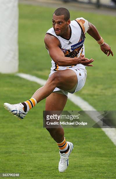 Josh Gibson of the Hawks kicks the ball during the AFL NAB Cup match between the North Melbourne Kangaroos and the Hawthorn Hawks at Highgate...