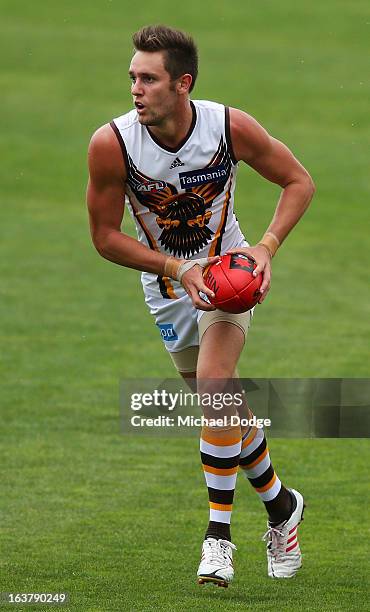 Jack Gunston of the Hawks looks ahead with the ball during the AFL NAB Cup match between the North Melbourne Kangaroos and the Hawthorn Hawks at...