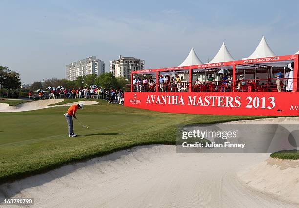 Liang Wenchong of China putts on the 18th hole during day three of the Avantha Masters at Jaypee Greens Golf Club on March 16, 2013 in Delhi, India.