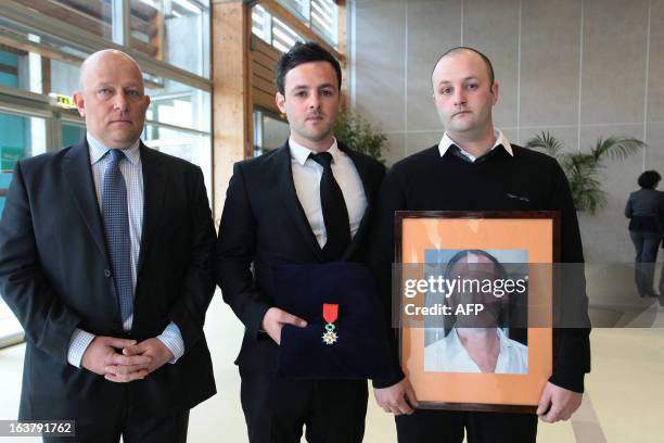 Unidentified relatives of Yann Desjeux a former French Marine Infantry paratrooper, who was killed on January 18, 2013 when the Algerian army stormed...