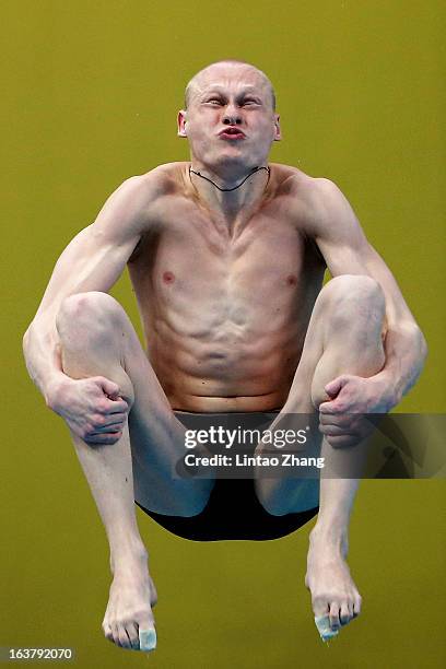 Llya Zakharov of Russia competes in the Men's 3m springboard final during the day two of the FINA Diving World Series at the National Aquatics Center...