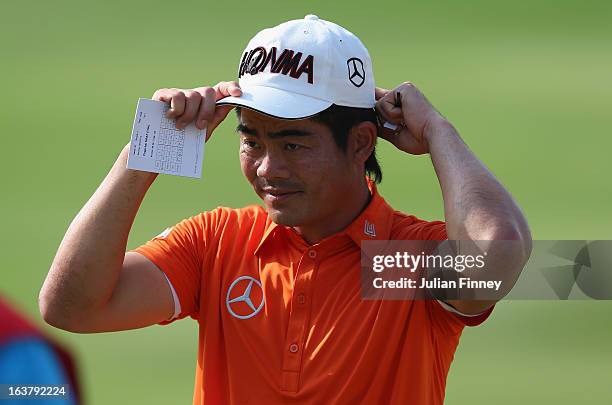 Liang Wenchong of China leaves the last hole during day three of the Avantha Masters at Jaypee Greens Golf Club on March 16, 2013 in Delhi, India.