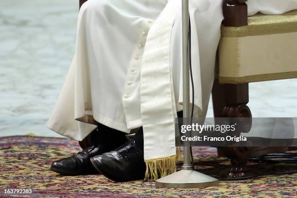Detail of the shoes of newly elected Pope Francis as he attends his first audience with journalists and media inside the Paul VI hall on March 16,...