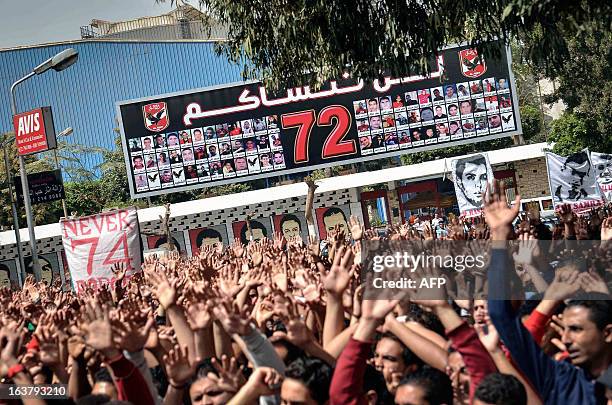 Supporters of Egypt's Al-Ahly football club protest outside the public prosecutor's office in Cairo on March 16 demanding the release of fellow...