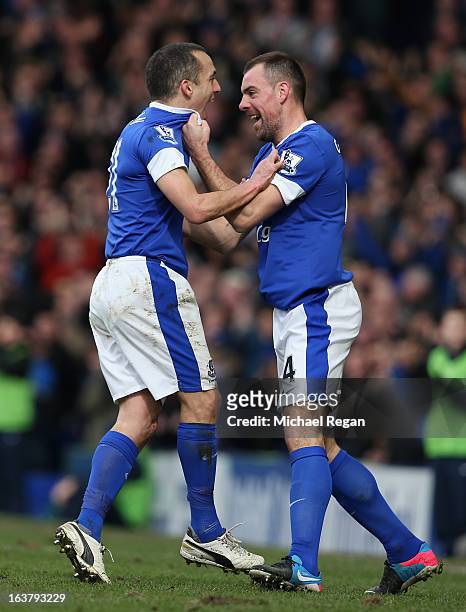 Leon Osman of Everton celebrates scoring the opening goal with team-mate Darron Gibson during the Barclays Premier League match between Everton and...