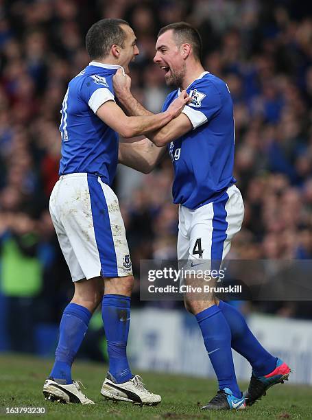 Leon Osman of Everton celebrates scoring the opening goal with team-mate Darron Gibson during the Barclays Premier League match between Everton and...