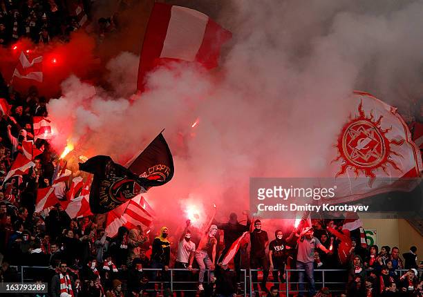 Spartak Moscow fans light flares during the Russian Premier League match between FC Spartak Moscow and FC Lokomotiv Moscow at the Luzhniki Stadium on...
