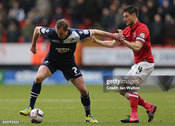 Johnnie Jackson of Charlton Athletic tries to tackle Rob Hulse of Millwall during the npower Championship match between Charlton Athletic and...