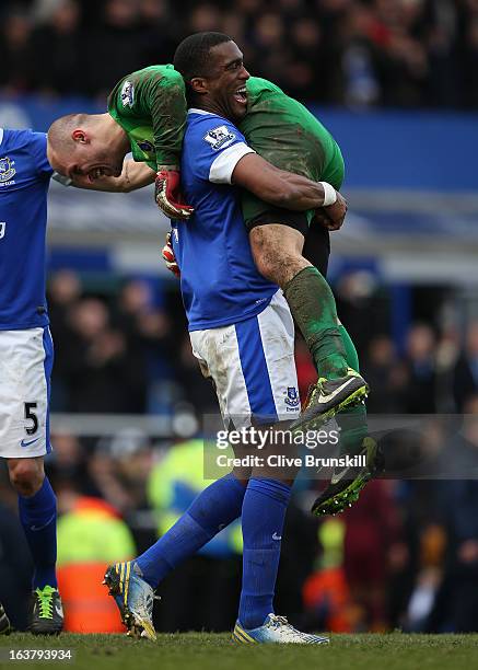 Sylvain Distin of Everton celebrates with team-mate Jan Mucha at the end of the Barclays Premier League match between Everton and Manchester City at...