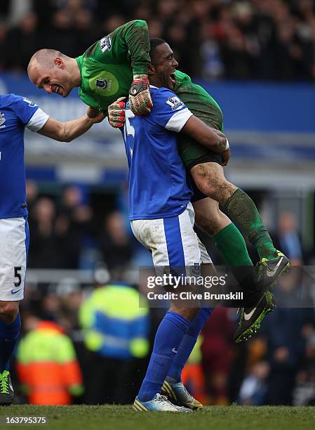 Sylvain Distin of Everton celebrates with team-mate Jan Mucha at the end of the Barclays Premier League match between Everton and Manchester City at...