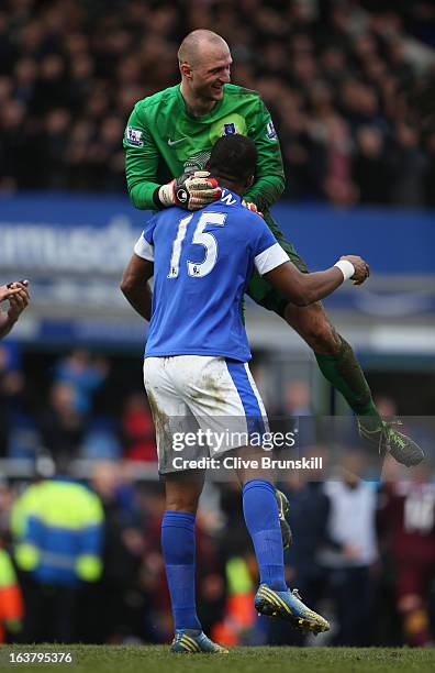 Sylvain Distin of Everton celebrates with team-mate Jan Mucha at the end of the Barclays Premier League match between Everton and Manchester City at...