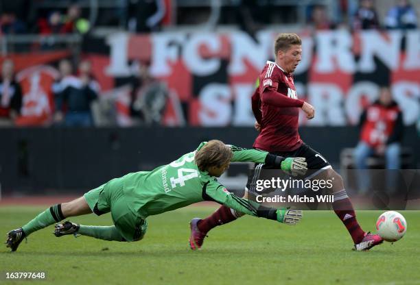 Mike Frantz of Nuernberg scores his team's third goal past goalkeeper Timo Hildebrand of Schalke during the Bundesliga match between 1. FC Nuernberg...